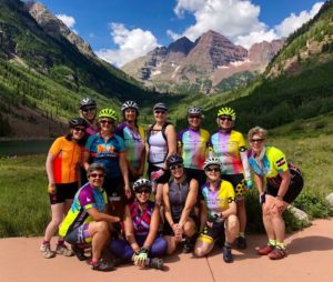 Venus Bike Club members posing in front of Maroon Bells