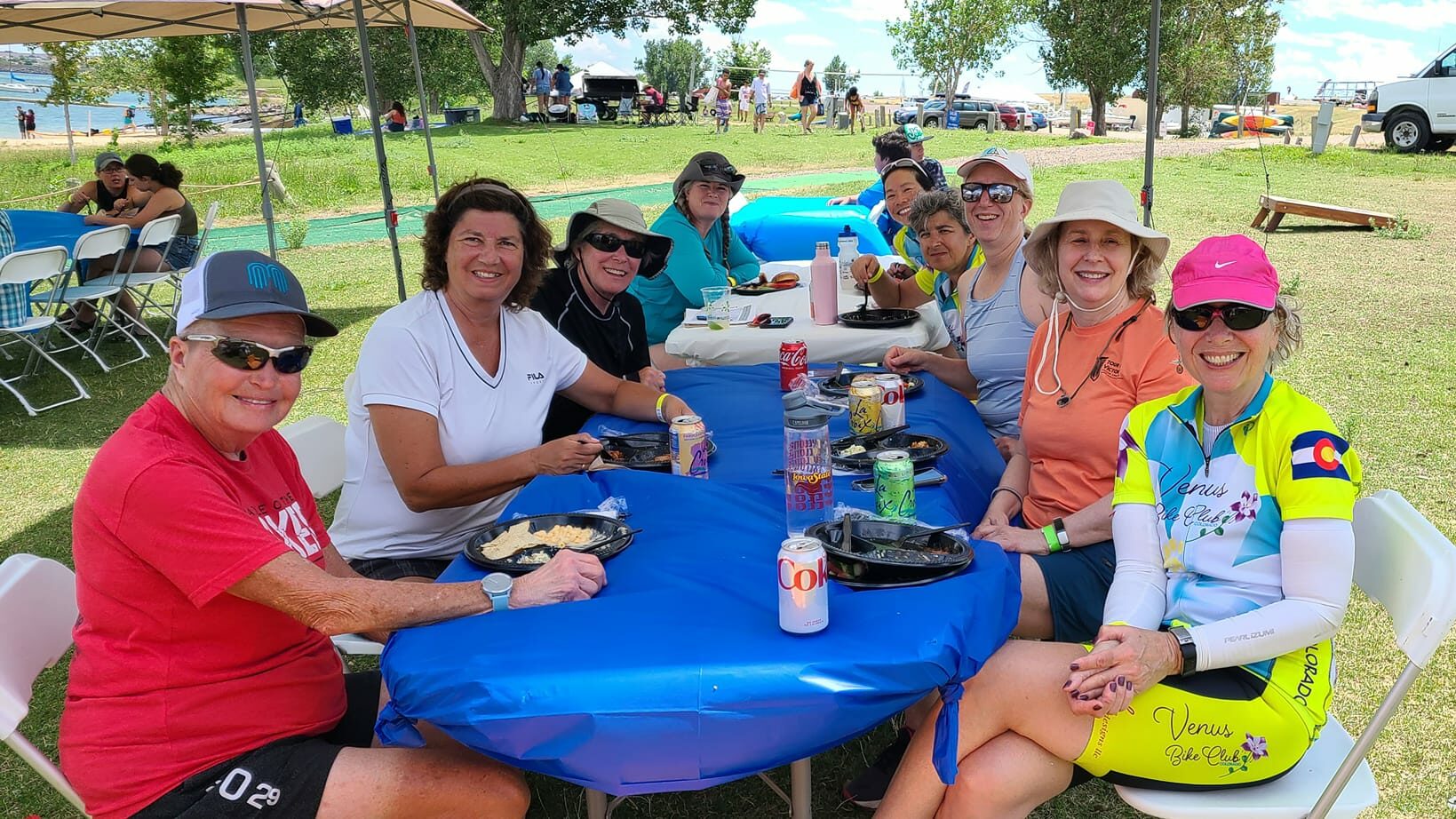 Venus sisters seated and smiling around a table