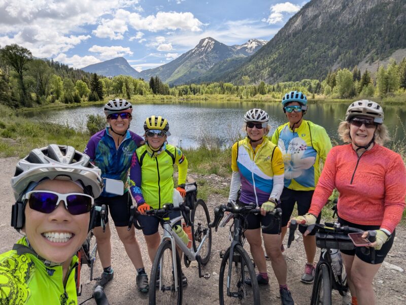 Six Venus sisters standing in front of a lake along the road to Marble, CO