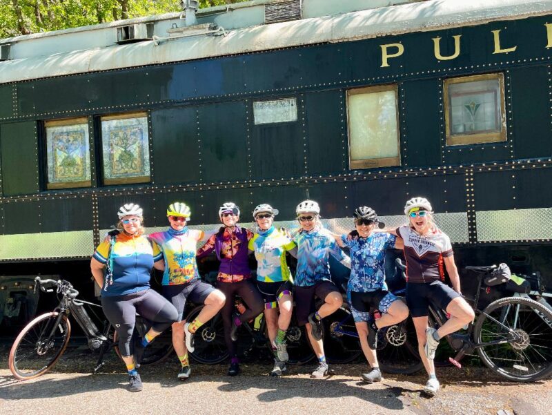 Venus sisters posing in front of a Pullman train car along the Rio Grande Trail