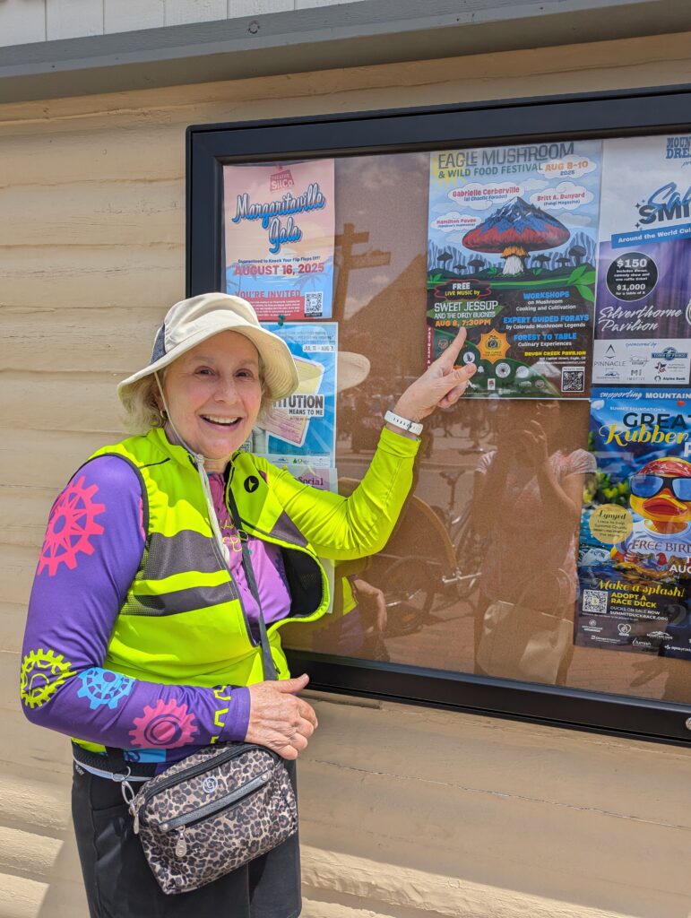 Venus sister pointing to an event flyer