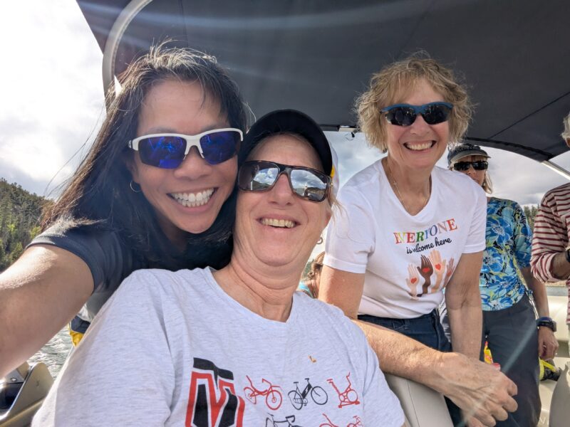 Venus members on a pontoon, smiling