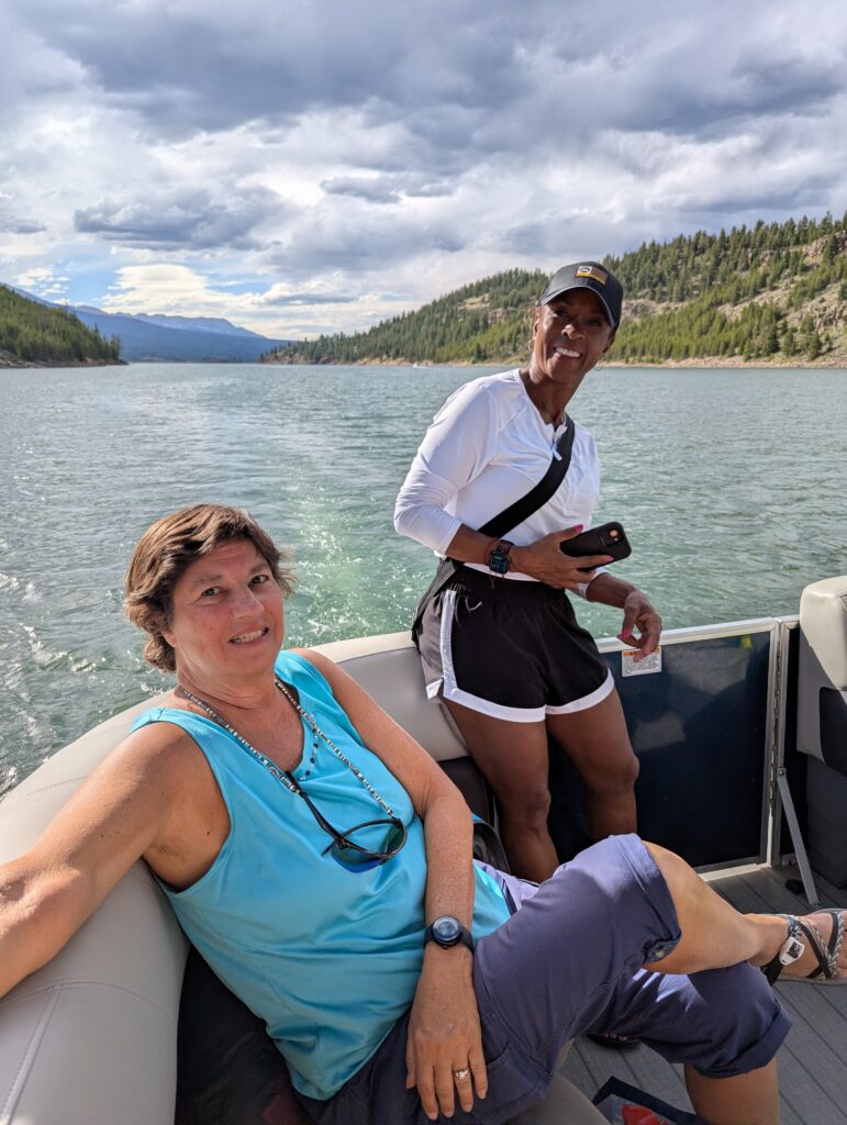 Venus members on a pontoon, smiling