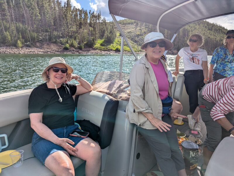 Venus members on a pontoon, smiling