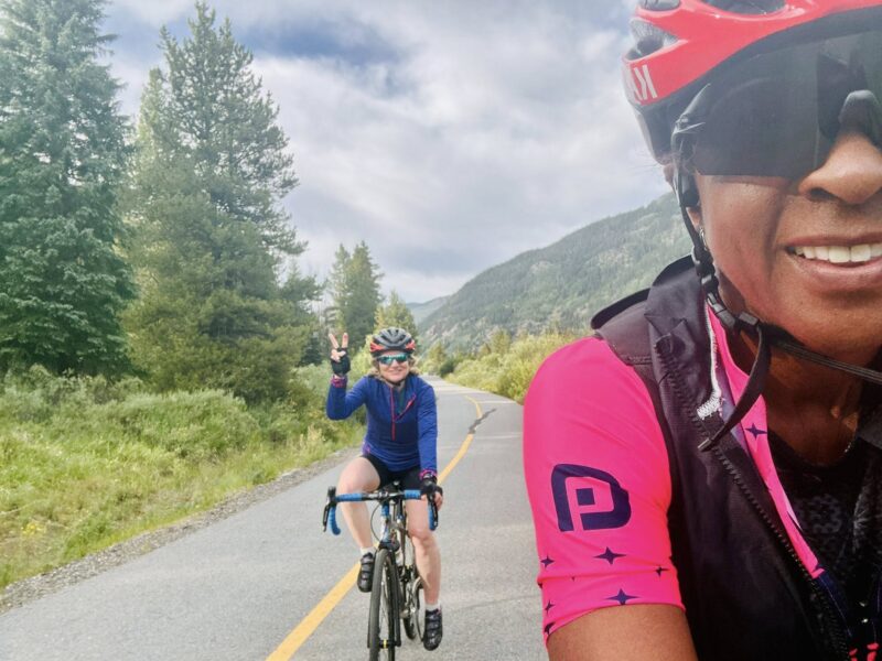 Two Venus members riding on a bike path